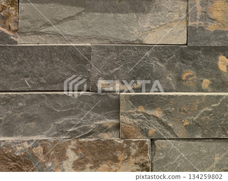 elegant slate tiles in green and grey with sleek joints for modern interiors and outdoor features 134259802