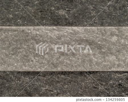 architectural sample showcasing charcoaltoned slate with horizontal band for modern facades 134259805