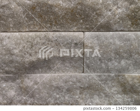 stone masonry with rough texture suitable for fireplace surrounds and building restoration 134259806