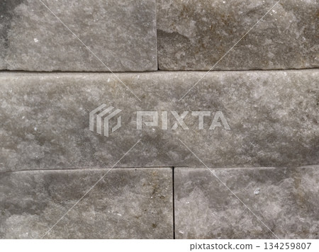 refined mineral grain wall design, stylish interior accent wall featuring linear seams and tactile 134259807