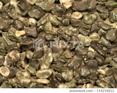 green stone pattern, damp pebbles with lichen, quiet mosscovered stones with subtle lichen accents 134259812