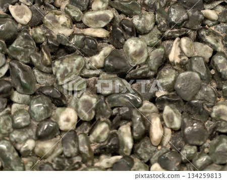 smooth glossy river rock textures, calming stone visuals emphasizing serenity and tranquil ambiance smooth glossy river rock textures, calming stone visuals emphasizing serenity and tranquil ambiance 134259813