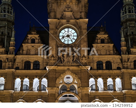 luminous clock sculpture with arches and detailed carvings creates mysterious nighttime ambiance luminous clock sculpture with arches and detailed carvings creates mysterious nighttime ambiance 134259952