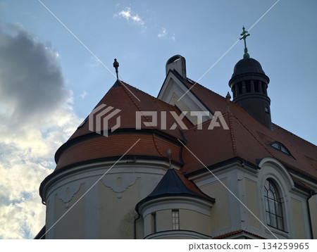 classic church with terracotta domes and intricate details illuminated by late afternoon sun 134259965