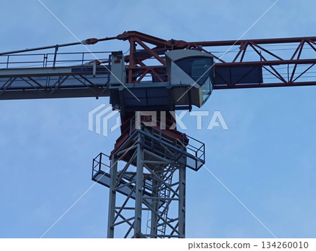 bright daytime industrial scene, sunlit tower showcases detailed steel framework and platform stairs bright daytime industrial scene, sunlit tower showcases detailed steel framework and platform stairs 134260010