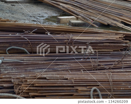 scrap rebar in yard environment, rusty metallic rebars bundled and prepared for recycling process scrap rebar in yard environment, rusty metallic rebars bundled and prepared for recycling process 134260209