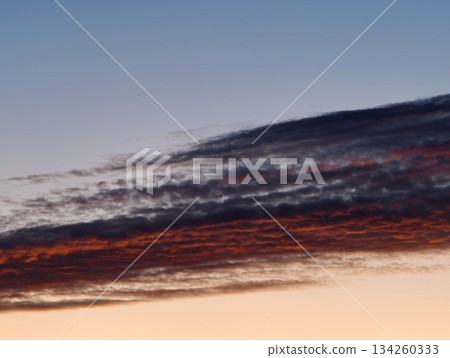 colorful sky with dramatic clouds, evening horizon showcasing striking cloud patterns in vivid shades colorful sky with dramatic clouds, evening horizon showcasing striking cloud patterns in vivid shades 134260333