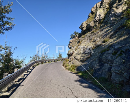 winding ascent through rocky landscape offering expansive horizon views and adventure opportunities 134260341