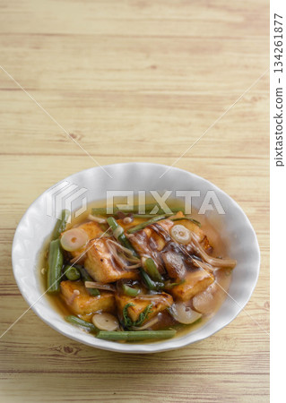 Deep-fried tofu with wild vegetables in a thick sauce Deep-fried tofu with wild vegetables in a thick sauce 134261877