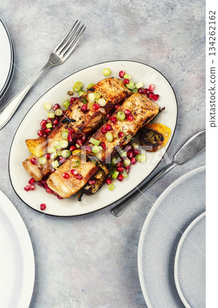 Two grilled salmon steaks on a wooden table. Two grilled salmon steaks on a wooden table. 134262162
