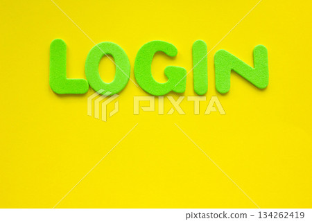 The word LOGIN made with green letters written on a yellow background. 134262419