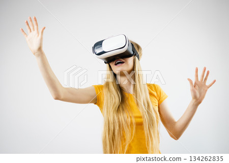 Girl wearing virtual reality goggles. 134262835