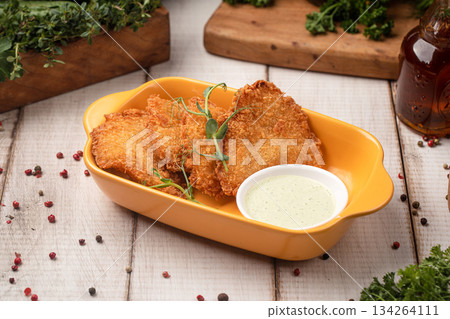 Crispy chicken cutlets with dipping sauce 134264111