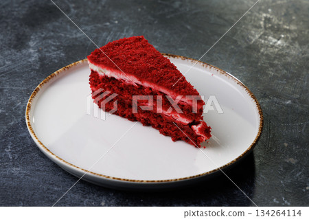 Red Velvet Cake Slice on White Plate With Creamy Frosting 134264114