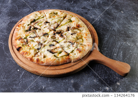 Gourmet Mushroom Cheese Pizza On Circular Wooden Board Gourmet Mushroom Cheese Pizza On Circular Wooden Board 134264176