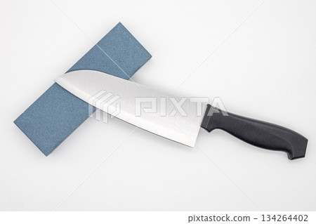Blue whetstone (and stone) and knife placed on a white background Image of sharpening cooking, kitchen utensils and blades 134264402