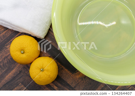 A set of yuzu, towel, and washbasin. Image of preparation for yuzu bath on the winter solstice. 134264407