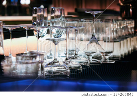 Closeup image of Glassware on bar counter in restaurant. Closeup image of Glassware on bar counter in restaurant. 134265045