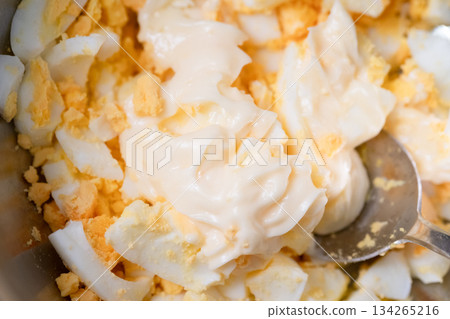 Mixing mashed boiled eggs and mayonnaise Mixing mashed boiled eggs and mayonnaise 134265216