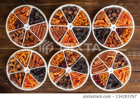 A collection of different types of dried fruit in a variety of shapes and sizes 134265767