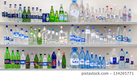 Yerevan Armenia 12.5.2025. A shelf full of water bottles with different colors and designs Yerevan Armenia 12.5.2025. A shelf full of water bottles with different colors and designs 134265771