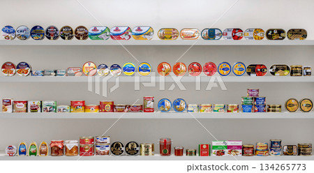 Yerevan Armenia 12.5.2025. A shelf full of canned goods, including some that say "tuna." Yerevan Armenia 12.5.2025. A shelf full of canned goods, including some that say "tuna." 134265773