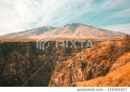 A mountain range with a valley in between A mountain range with a valley in between 134265827