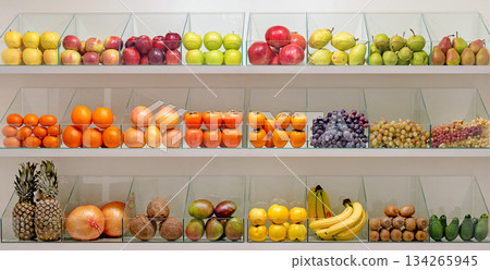 A fruit display with a variety of fruits including apples, oranges, bananas A fruit display with a variety of fruits including apples, oranges, bananas 134265945