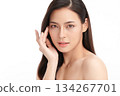 A beautiful young Asian woman with clean, fresh skin against a white background. Skincare, facial treatment, cosmetology, beauty, and spa. An elegant portrait of an Asian woman. 134267701