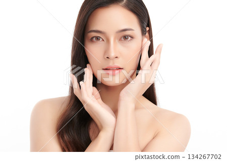 A beautiful young Asian woman with clean, fresh skin against a white background. Skincare, facial treatment, cosmetology, beauty, and spa. An elegant portrait of an Asian woman. A beautiful young Asian woman with clean, fresh skin against a white background. Skincare, facial treatment, cosmetology, beauty, and spa. An elegant portrait of an Asian woman. 134267702
