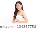 A beautiful young Asian woman with clean, fresh skin against a white background. Skincare, facial treatment, cosmetology, beauty, and spa. An elegant portrait of an Asian woman. 134267758