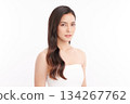A beautiful young Asian woman with clean, fresh skin against a white background. Skincare, facial treatment, cosmetology, beauty, and spa. An elegant portrait of an Asian woman. 134267762