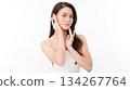 A beautiful young Asian woman with clean, fresh skin against a white background. Skincare, facial treatment, cosmetology, beauty, and spa. An elegant portrait of an Asian woman. 134267764