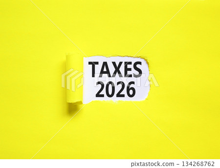 Taxes 2026 new year symbol. Concept words Taxes 2026 on beautiful white paper. Beautiful yellow paper background. Business and taxes 2026 new year concept. Copy space. Taxes 2026 new year symbol. Concept words Taxes 2026 on beautiful white paper. Beautiful yellow paper background. Business and taxes 2026 new year concept. Copy space. 134268762