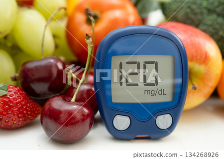 Glucose meter with vegetable and fruit for check sample blood sugar level to treatment diabetes. 134268926