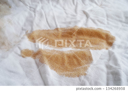 Dirty tomato sauce stain removal or ketchup on cloth accident to wash with washing powder, cleaning housework. 134268938