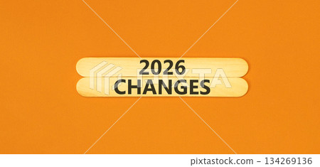 2026 Changes symbol. Concept words 2026 Changes on beautiful wooden sticks. Beautiful orange paper background. Business and 2026 changes concept. Copy space. 134269136