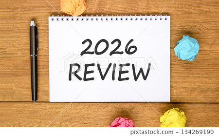 2026 Review symbol. Concept words 2026 Review on beautiful white note. Beautiful wooden background. Black pen. Colored paper. Business and 2026 review concept. Copy space. 134269190