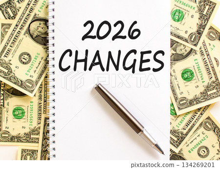 2026 Changes symbol. Concept words 2026 Changes on beautiful white note. Beautiful dollar bills background. Black pen. Dollar bills. Business and 2026 changes concept. Copy space. 2026 Changes symbol. Concept words 2026 Changes on beautiful white note. Beautiful dollar bills background. Black pen. Dollar bills. Business and 2026 changes concept. Copy space. 134269201