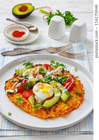potato rosti topped with poached egg, avocado potato rosti topped with poached egg, avocado 134270046