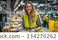 A female worker sorting packages at a logistics warehouse. A scene from a bright and positive workplace. 134270262