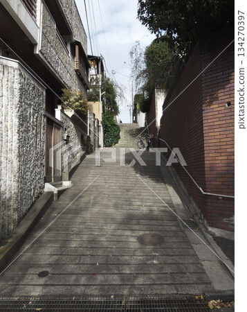 Steep concrete slopes and stairs in a quiet residential area 134270397