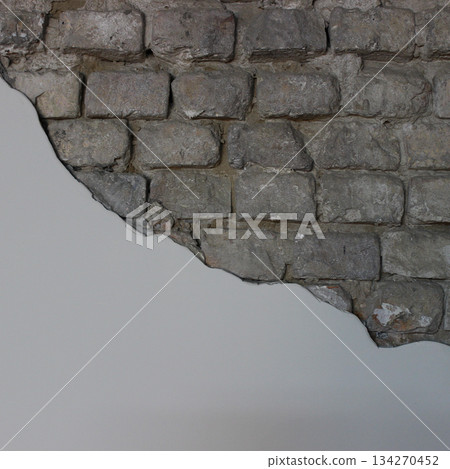 Unfinished brick wall with smooth plaster level surface for titles or text space. Old brickwork with copy space stock photo for banner design 134270452