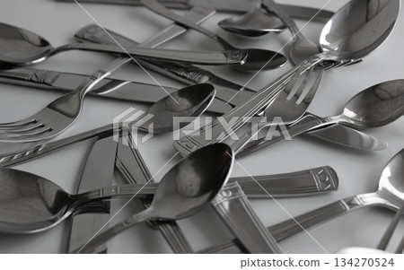 Closeup View Of Tarnished Steel Spoons, Forks And Table Knives. Photo For Cutlery Setting Illustration Closeup View Of Tarnished Steel Spoons, Forks And Table Knives. Photo For Cutlery Setting Illustration 134270524
