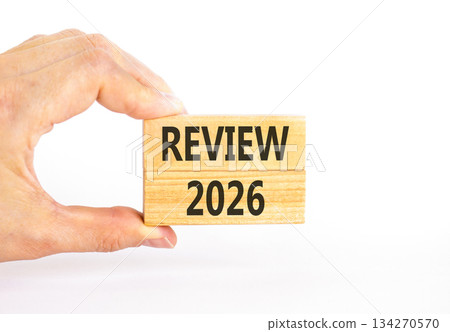 Review 2026 symbol. Concept words Review 2026 on beautiful wooden blocks. Beautiful white paper background. Businessman's hand. Business and review 2026 concept. Copy space. Review 2026 symbol. Concept words Review 2026 on beautiful wooden blocks. Beautiful white paper background. Businessman's hand. Business and review 2026 concept. Copy space. 134270570