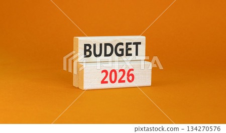 Budget 2026 symbol. Concept words Budget 2026 on beautiful wooden blocks. Beautiful orange paper background. Business and budget 2026 concept. Copy space. Budget 2026 symbol. Concept words Budget 2026 on beautiful wooden blocks. Beautiful orange paper background. Business and budget 2026 concept. Copy space. 134270576