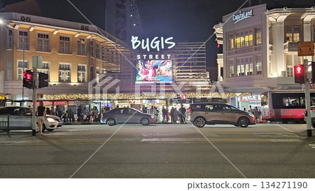 This is Bugis Street glows at night with neon signage, colonial facades, bustling traffic This is Bugis Street glows at night with neon signage, colonial facades, bustling traffic 134271190