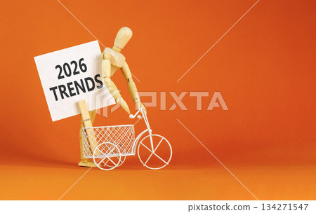 2026 Trends new year symbol. Concept words 2026 Trends on beautiful white card. Beautiful orange paper background. Businessman's model. Business and 2026 Trends new year concept. Copy space. 134271547