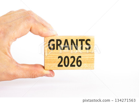 Grants 2026 symbol. Concept words Grants 2026 on beautiful wooden blocks. Beautiful white paper background. Businessman's hand. Business and grants 2026 concept. Copy space. Grants 2026 symbol. Concept words Grants 2026 on beautiful wooden blocks. Beautiful white paper background. Businessman's hand. Business and grants 2026 concept. Copy space. 134271563