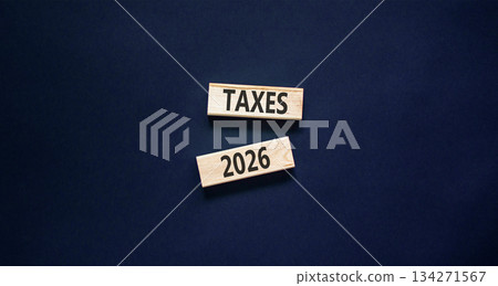 Taxes 2026 new year symbol. Concept words Taxes 2026 on beautiful wooden blocks. Beautiful black paper background. Business and taxes 2026 new year concept. Copy space. Taxes 2026 new year symbol. Concept words Taxes 2026 on beautiful wooden blocks. Beautiful black paper background. Business and taxes 2026 new year concept. Copy space. 134271567
